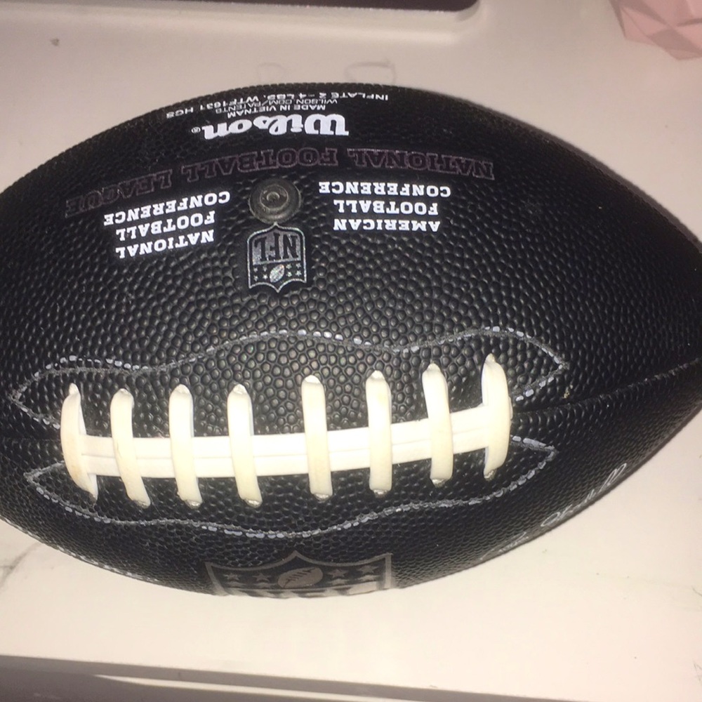 Color is black it’s an nfl mini football for kids